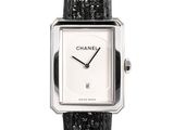 a close up of a watch with a black strap on a white background