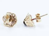 pair of yellow gold earrings with a flower design