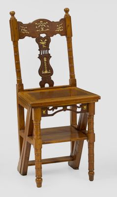a wooden chair that has a wooden seat on it