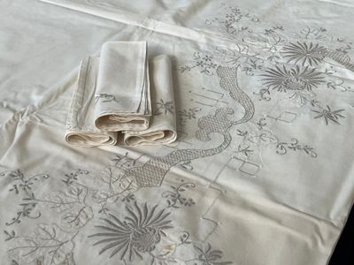 three napkins on a table with a white table cloth