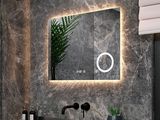 a bathroom with a sink, mirror, and a plant in it