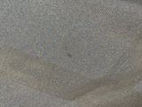 a close up of a piece of cloth with a hole in it