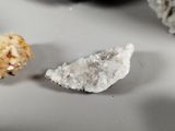 a small piece of rock next to a smaller piece of rock