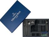 a blue box with a set of forks and spoons in it