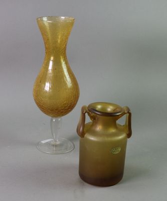 two vases sitting next to each other on a table