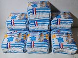 several packs of diapers stacked on top of each other on a table
