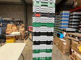 many stacks of boxes stacked on top of each other in a warehouse