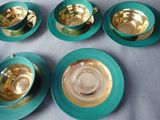 six tea cups and saucers are sitting on a table