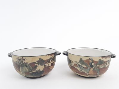 two bowls sitting side by side on a white surface