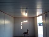 a empty room with a chair in the middle of it