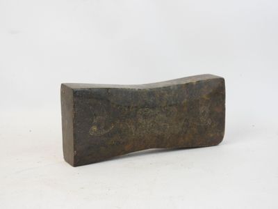a close up of a wooden block on a white surface