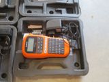 an orange and black cell phone sitting in a case