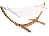 a white hammock sitting on top of a wooden stand