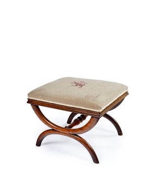 an image of a small wooden stool with a cushion on it