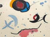 a close up of a painting on a white surface