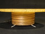 a close up of a wooden table on a black background