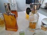 many different types of perfume bottles on a table