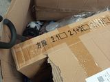 a cardboard box that has a pair of scissors in it