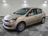 a picture of a beige car parked in a garage
