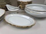 a lot of plates and bowls on the table