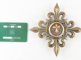 a badge with a picture of a woman on it next to a credit card