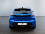 the rear end of a blue car in a white room