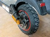 a scooter that is parked in a garage