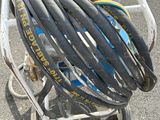a cart with a bunch of bicycle rims on top of it