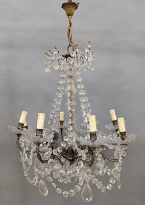 an antique crystal chandelier with four lights hanging from the ceiling