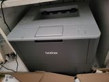 a printer that is sitting on top of a cardboard box