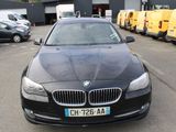 une photo d'une BMW noire garée sur un parking