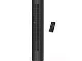 an image of a black tower fan with a remote on top of it