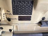 a close up of a sewing machine with buttons and numbers on it