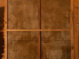 a picture of a wooden window with a glass pane