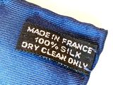label on a blue shirt that says made in france 100 % silk dry clean only