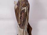 an image of a statue of a man holding a bird