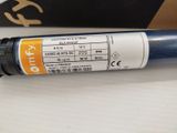 a blue tube with a yellow label on it sitting on a table