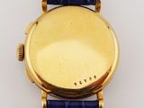 an image of a close up of a watch on a white surface
