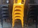 four chairs lined up against a wall in a restaurant