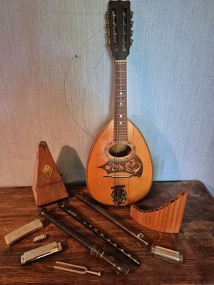 a guitar and other musical instruments sitting on a table