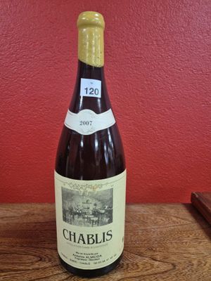 a bottle of wine that is sitting on a table