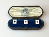 two playing cards in a case on a table