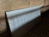 a radiator that is sitting in the corner of a room