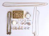 many different types of jewelry laid out on a white surface