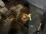 a pan with food cooking on the stove in the kitchen