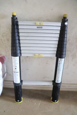 two ladders sitting next to each other on the floor