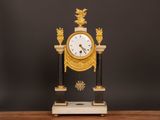a clock that is sitting on top of a table