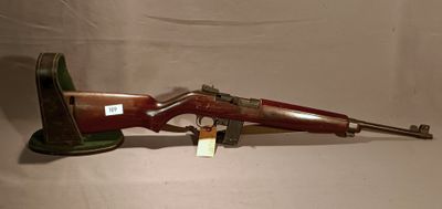 an old rifle with a wooden barrel and a metal handle
