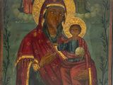 une peinture ancienne représentant une femme tenant un enfant dans ses bras