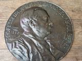 a close up of a medal on a wooden table